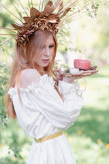 Fototapeta premium Bride of the sun in white in the apple trees 