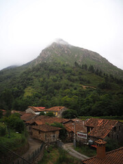 A small abandoned village at the foot of a huge mountain