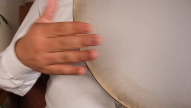 playing oriental drum