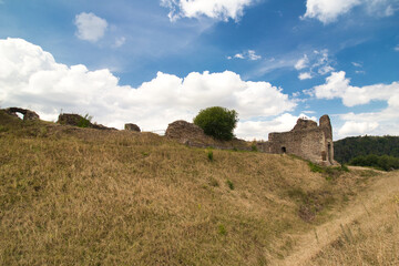 Ruins of Lichnice castle in summer cloudy day. Czech Republic.