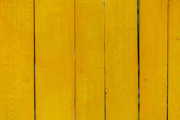 Yellow wooden boards textured background. Coloured vertical planks