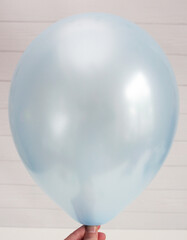 blue mother-of-pearl latex balloon isolated on white background
