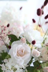 Bouquet with white roses and hydrangeas in the interior