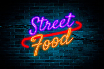 Street Food sign symbol neon banner on brick wall background.