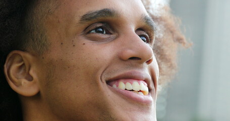 African american black man face opening eyes smiling feeling happy and contemplation