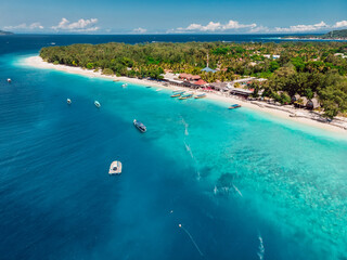 Fototapeta na wymiar Tropical beach, blue ocean and boats. Aerial view.