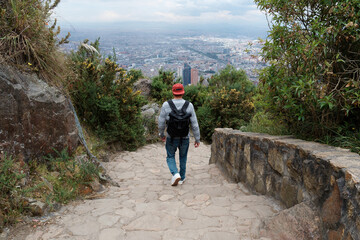 Man tourist goes down the stairs Mount Monserrate. Colombia.