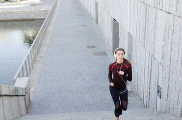 healthy happy woman jogging running outdoor listening music