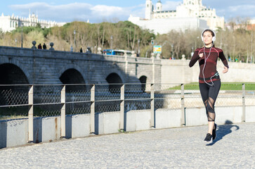 Obraz premium woman stretching resting after running and jogging in a park with sportswear