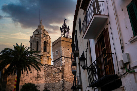view of spanish town of Sitges landmark building of the Ajuntament, known as Casa de la Vila, at sunset with dramatic light