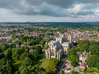 Fototapeta na wymiar Ripon Cathedral North Yorkshire place of worship church and wedding venue. Drone aerial view of Ripon town centre and cathedral. Yorkshire England, United Kingdom 