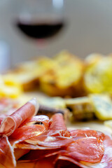 Wine, cheese, bacon and prosciutto