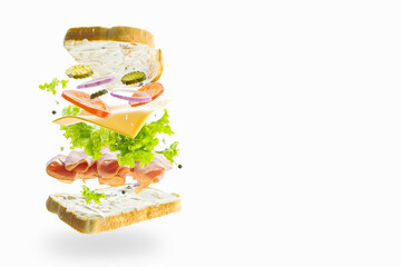 Hamburger with vegetables, greens, selected meat and bread slices in a frozen flight on a white background. Minimalism. Abstraction. There are no people in the photo. There is free space to insert.