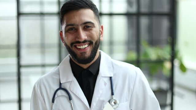 man wearing doctor coat with a confident expression on smart face thinking serious