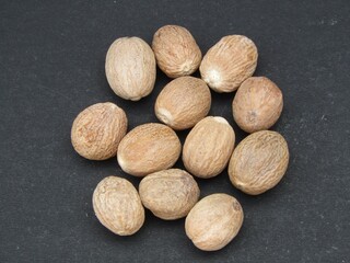 Nutmeg on black background 