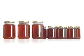 beekeeping - honey jars on white background