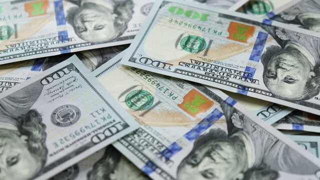 Timelapse of counting money. Pile of american dollars. New hundred dollar bills. Inflation and deflation concept. Hundreds usd. Money pattern. Close-up in 4K, UHD