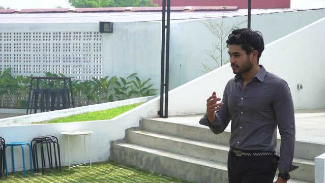 Bearded Man Smoking With Uneasy Looks While Walking