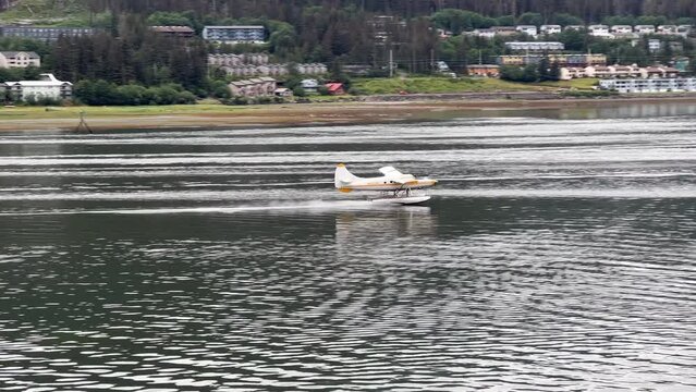 Sea plane landing in Juneau, Alaska in summer.