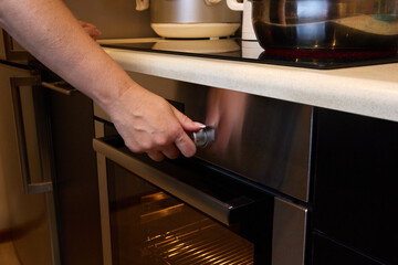 Glowing burner of the electric hotplate on black background