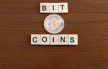 A Bitcoins coin on a wooden table
