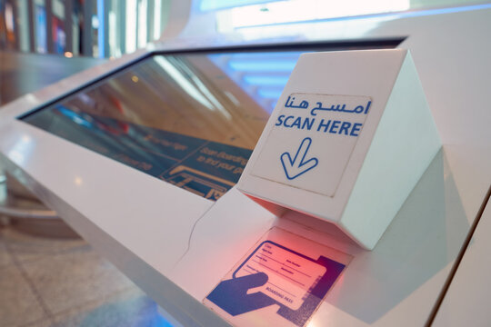 DUBAI, UAE - MAY 13, 2016: close up shot of boarding pass scanner at Dubai International Airport. Dubai International Airport is the primary airport serving Dubai, United Arab Emirates.