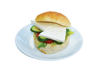Close up of sandwich with cheese, tomato, cucumber, lettuce served on white dish