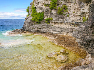 The Indian Head Cove in The Bruce Peninsula National Park, Ontario, Canada. Near The Grotto and Bruce trail. Georgian Bay at Tobermory. Canadian staycation. - obrazy, fototapety, plakaty
