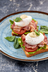 toasts with poached egg and bacon