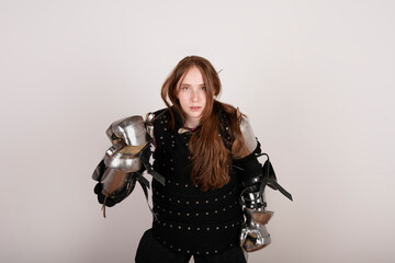 History of the Middle Ages. Portrait of a beautiful medieval female knight in armour on a white background..