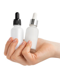 Hands of a beautiful woman hold two serum collagen moisturizer.
