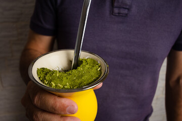Closeup Mature man of holing Chimarrao drink with mate herb..