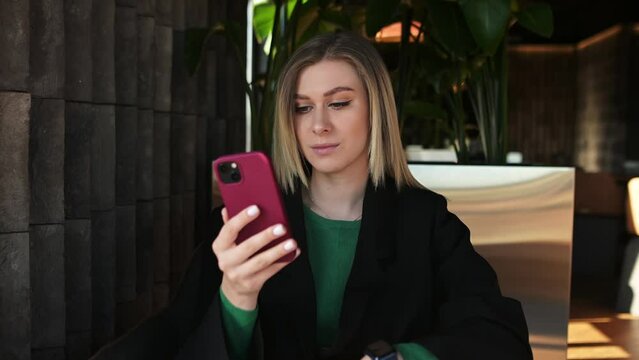 Head shot pretty millennial woman looking at cellphone screen, reading message with unbelievable good news, celebrating online lottery gambling giveaway win, getting secret sale notification.