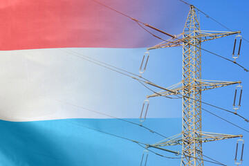 Luxembourg flag on electric pole background. Power shortage and increased energy consumption in...