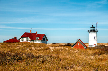 red lighthouse on the coast of the country