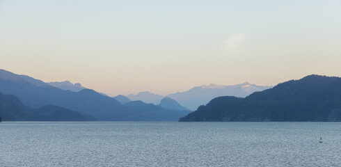 Harrison Lake during Sunny Summer Morning Sunrise. Canadian Nature Landscape Background. Harrison Hot Springs, British Columbia, Canada.