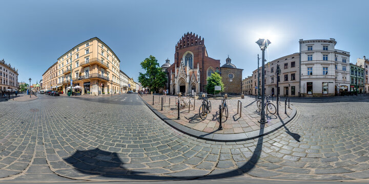 full 360 hdri panorama on main market square in center of old town with historical buildings, temples and town hall with a lot of tourists in equirectangular projection