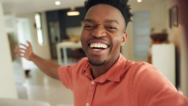 Thumbs up, lifestyle and influencer man in home lounge excited and happy while doing moving vlog. Person giving new house tour for realtor purchase with cellphone streaming app for announcement.