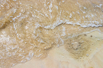 Fototapeta premium Small mini water waves at beach ocean with sand Mexico.