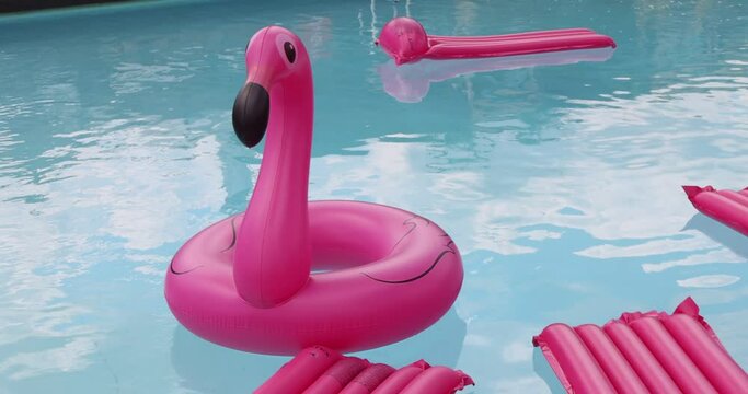 Vacation travel concept with inflatable pink flamingo float toy mattress