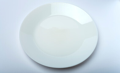 White plate isolated on white and gray background. Table service