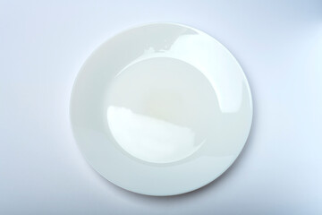 White plate isolated on white and gray background. Table service