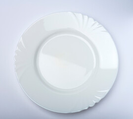 White plate isolated on white and gray background. Table service