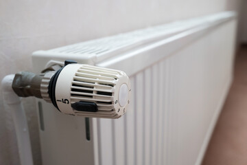 Radiator with thermostat and the ability to turn the knob and reduce the heating temperature....