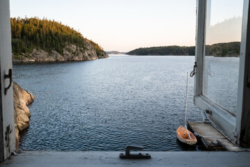 Old open window through which a magnificent seascape opens up, a view of the sea, a rocky coast, a...