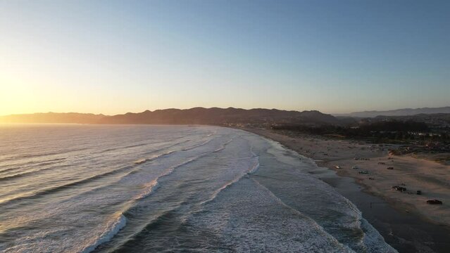 Aerial drone view of Pismo Beach in Central California at sunset