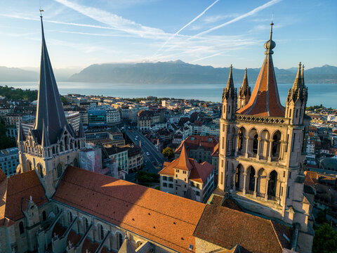 August 22nd 2022, Lausanne, Switzerland. A drone aerial shot of Lausanne cathedral and Lake Geneva at sunrise.