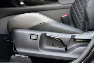 button and lever for adjusting seat position
