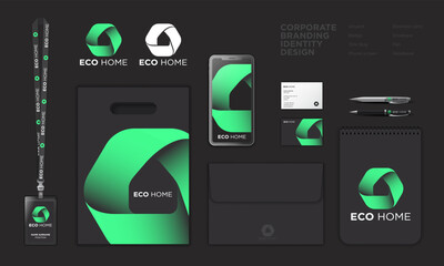 Eco Home logo. Innovation technology  House icon  consists of green bend ribbon. Identity: lanyard, badge, paper bag, screen, envelope, pen, business card. Black theme.
