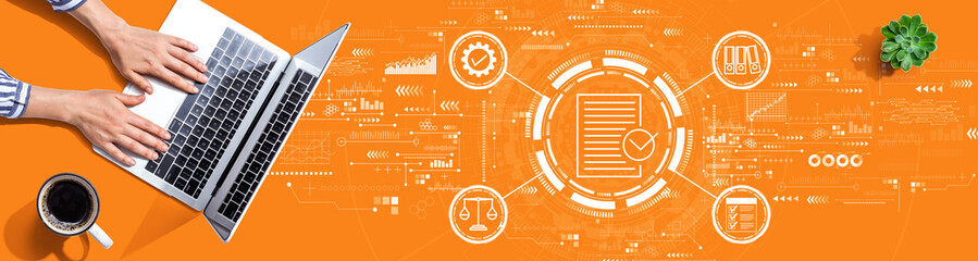 Compliance theme with person using a laptop computer